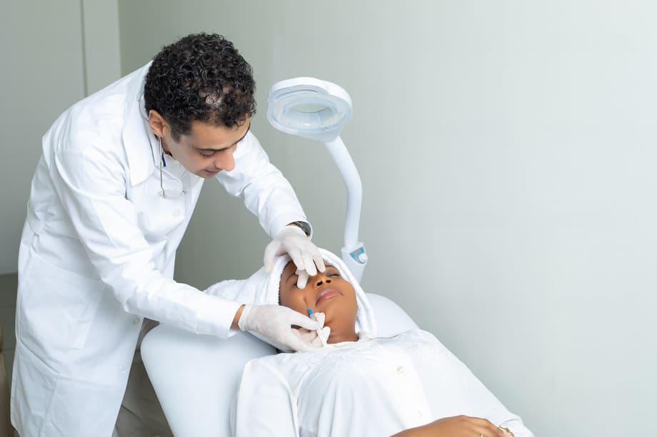 Skincare specialist performing Ozone skincare treatment on a woman at German Ozone Medical Centre.