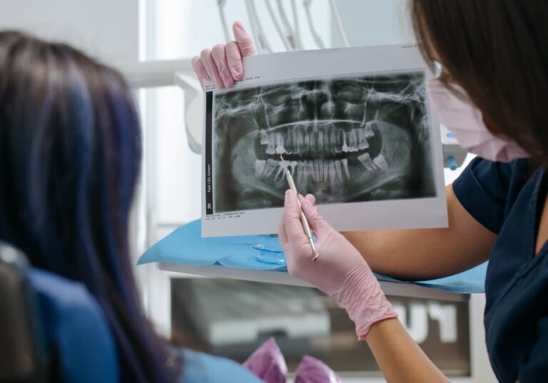 Are You a Candidate for Dental Implants? Find Out in Accra Dental implant procedure showing titanium post placement in jawbone.
